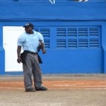 Umpire Leroy Fraser at work. 