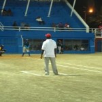 Visiting coach Melvrin Cornelia behind the plate on Friday evening 